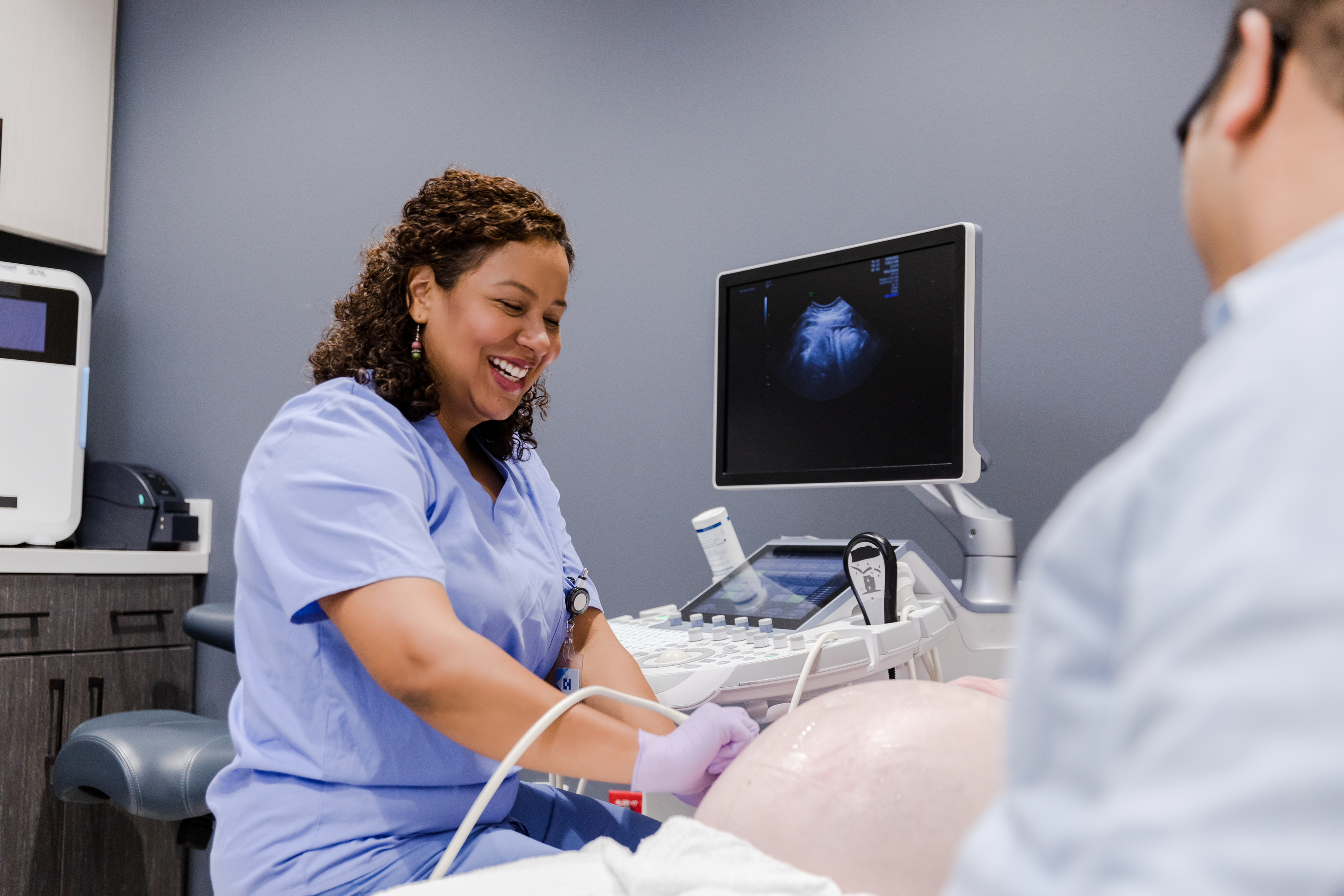 Sonographer using medical equipment