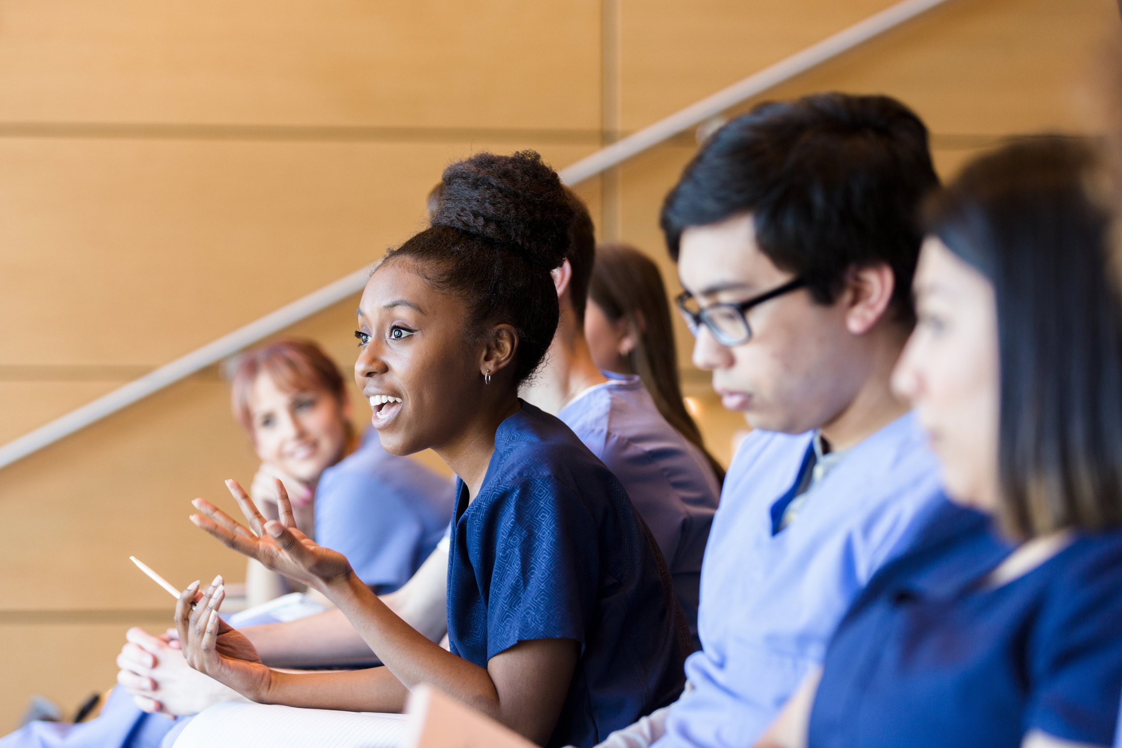 Medical school student asks question during class